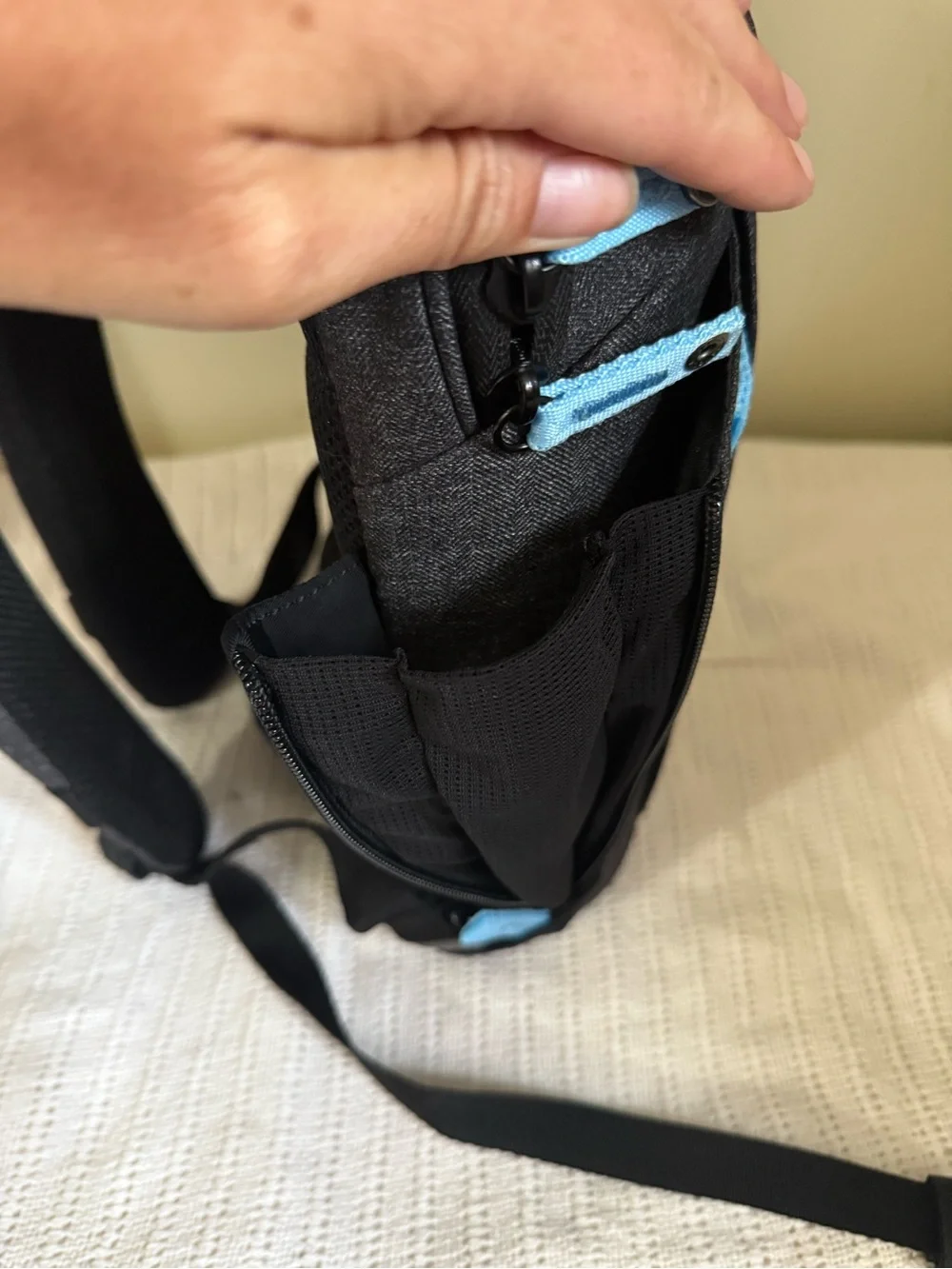 Men's Compact Black Sling Bag with Light Blue Accents